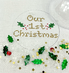 Christmas Ornament w/ Clear Dome Cover & Confetti – “Our 1St Christmas” w/ Holly – Gold Letters XMD-13