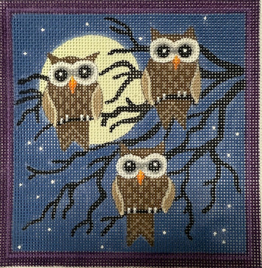 Needlepoint design of three owls on a branch with a night sky background.